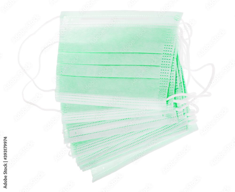 group of green surgical masks isolated on white group of green surgical masks isolated on white