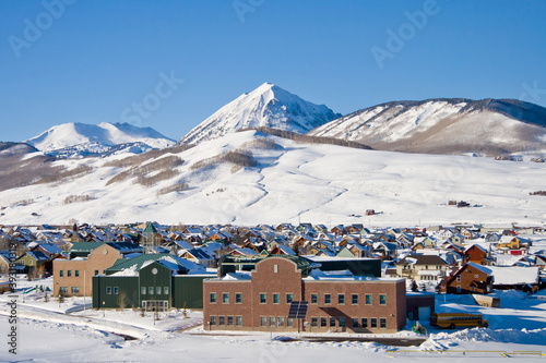 Crested Butte School - Photo of Crested Butte school with housing and Mt. Crested Butte in the backdrop on a sunny winter day photo