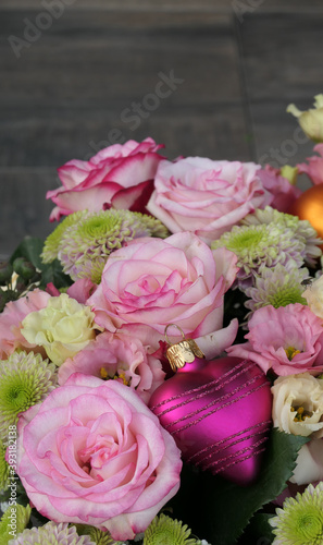 bouquet of roses with a pink heart bauble - copy space