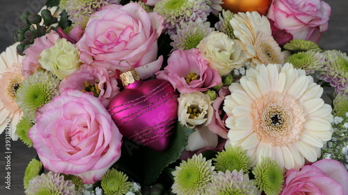 stunning bouquet of roses with a pink heart bauble - copy space