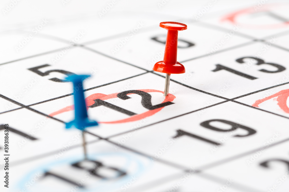 Thumbtack in calendar concept for busy, appointments and meeting reminders Thumbtack in calendar concept for busy, appointments and meeting reminders