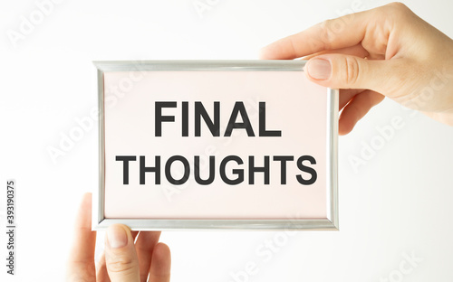 Writing text showing Final Thoughts. Business concept for Conclusion Summary Text written on notebook notepad note paper on wooden background with folded paper meaning thinking for idea photo