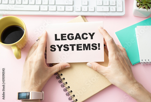 Writing text showing Legacy Systems. Business concept for Upgrade SOA Application written on sticky note paper on wooden background with pen, marker