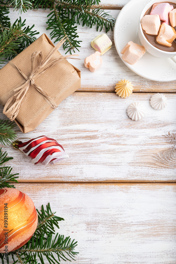 Christmas or New Year frame composition. Decorations, box, balls, fir and spruce branches, cup of coffee, on a white wooden background. Top view, copy space. Christmas or New Year frame composition. Decorations, box, balls, fir and spruce branches, cup of coffee, on a white wooden background. Top view, copy space.