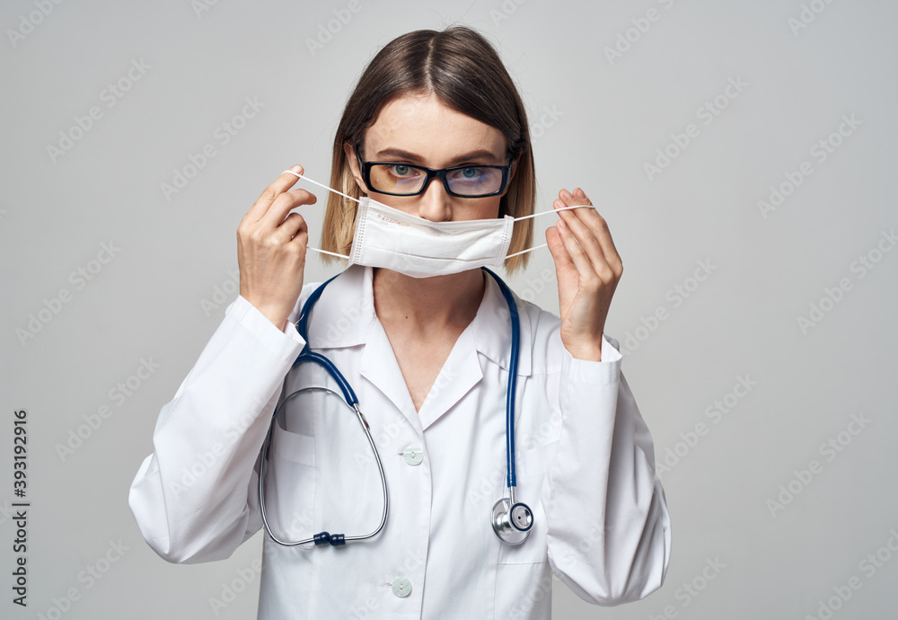Professional nurse in a medical gown and mask on the face of an infection laboratory Professional nurse in a medical gown and mask on the face of an infection laboratory