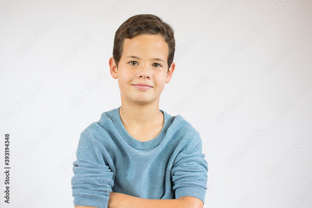 Happy smiling boy with arm crossing and white background Happy smiling boy with arm crossing and white background