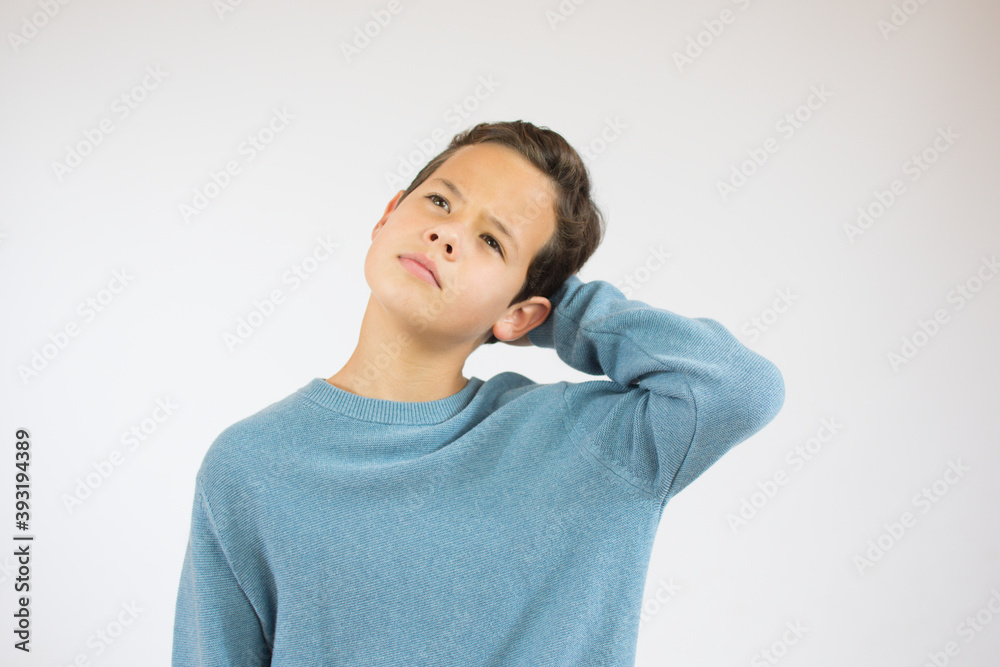 Pensive child with brown hair isolated on white background Pensive child with brown hair isolated on white background