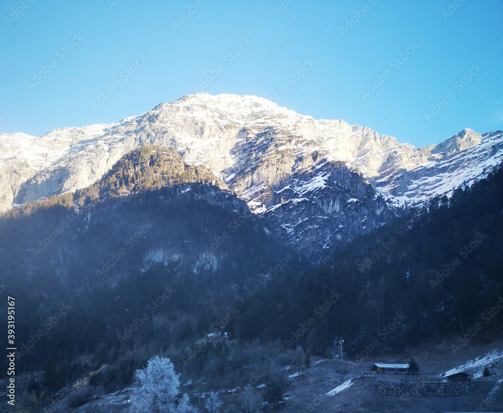 snow covered mountains and blue sky in winter