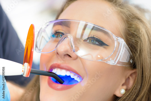 Dentist Using Ultraviolet Lamp photo