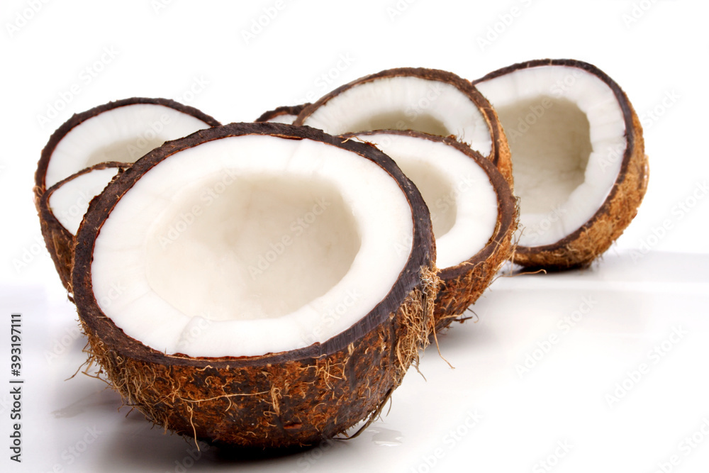 Close up of halved coconuts Close up of halved coconuts