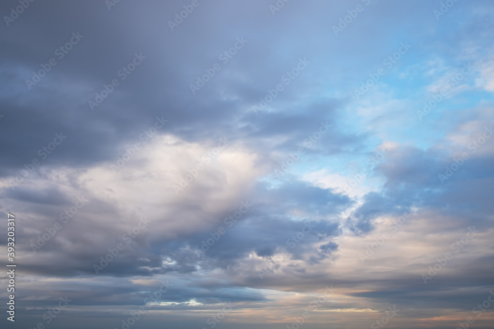 Clouds lit by the setting sun. Natural background from clouds