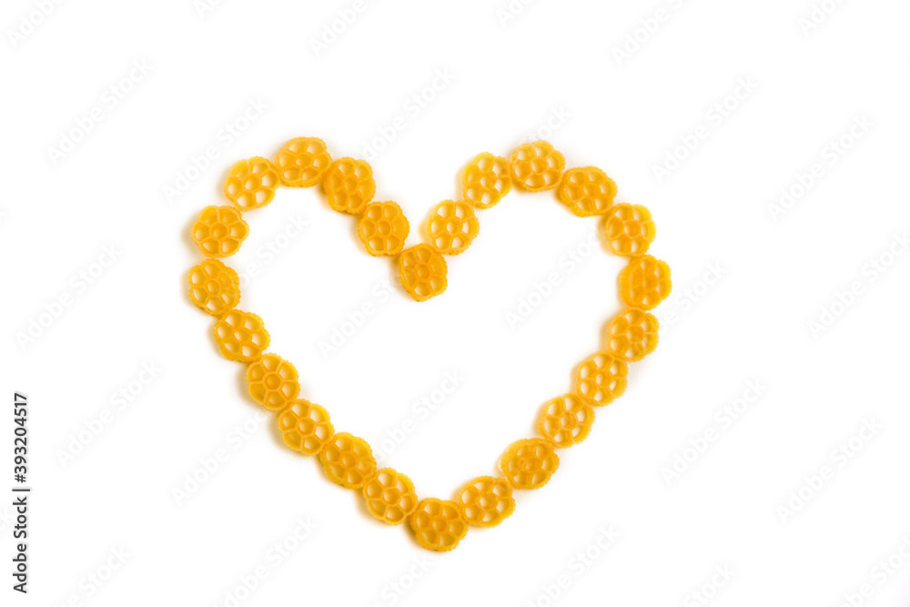 Heart shape made of raw Italian pasta isolated on white background Heart shape made of raw Italian pasta isolated on white background