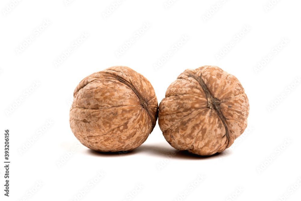 Walnuts in shell isolated on a white background Walnuts in shell isolated on a white background