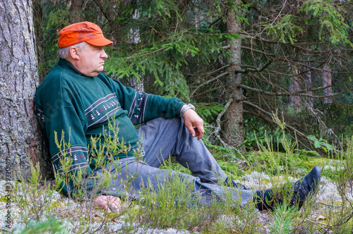 Old grandfather resting in the woods