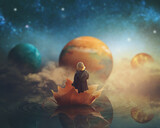 Little girl travelling through dream world, floating on a big fallen leaf; imagination/fantasy background; Elements of this image furnished by NASA