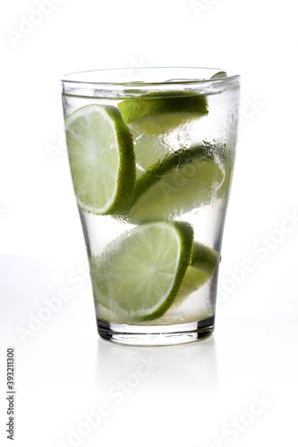 Studio shot of drink with lime slices