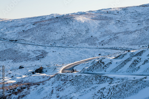 Winding road through a snowy landscape photo