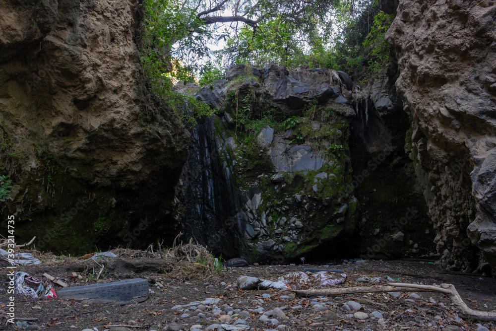 waterfall contaminated with car tires