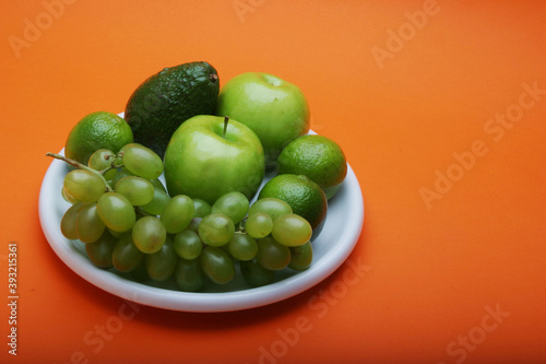 Exotic fruits on white plate
