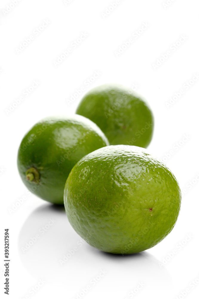 Limes on white background - close-up Limes on white background - close-up