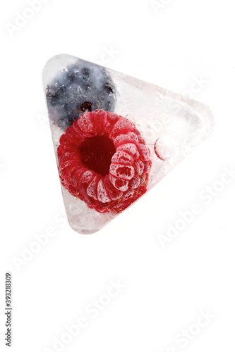 Raspberry and blueberry in ice