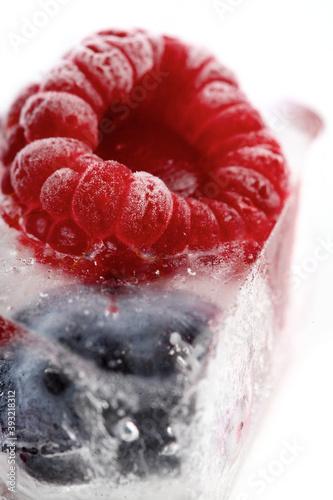 Raspberry and blueberry in ice