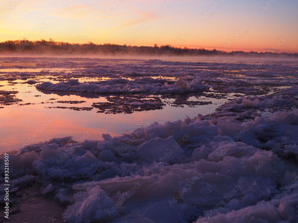 Ice drift on the Vyatka river during the winter dawn