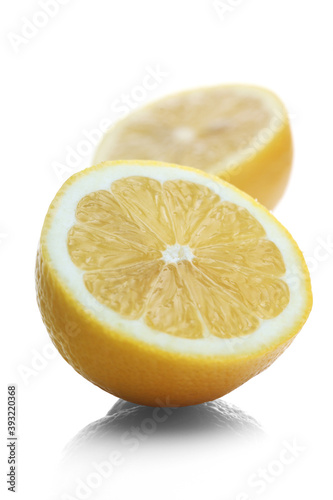 Halved lemon on white background