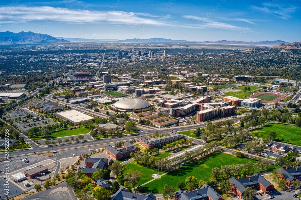Aerial View of large University in Utah with Salt Lake City Skyline in Background