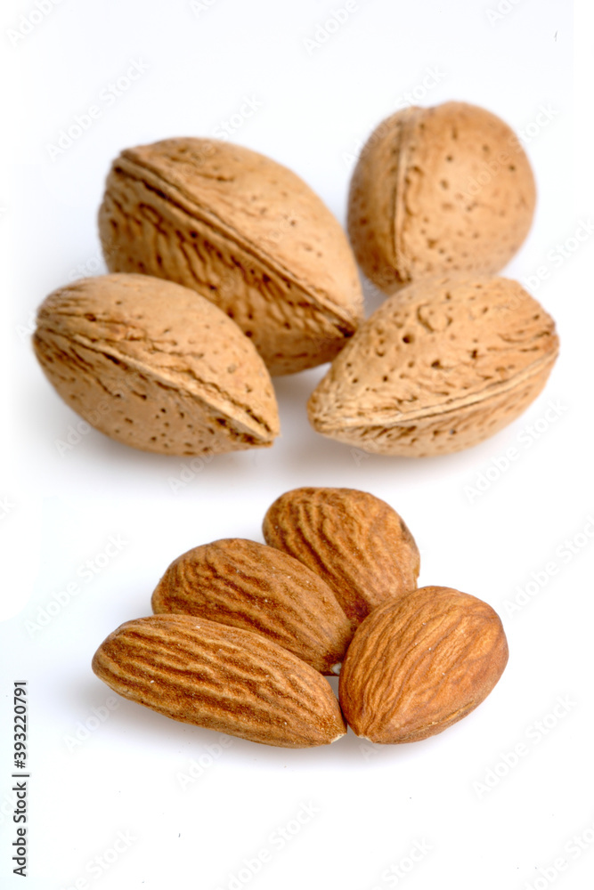 Almonds on white background - close-up Almonds on white background - close-up
