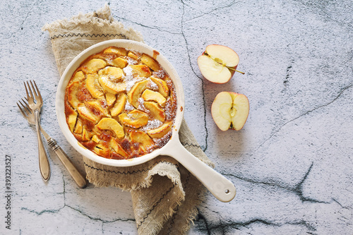 French cuisine. Apple clafoutis in ceramic dish for sweet dessert