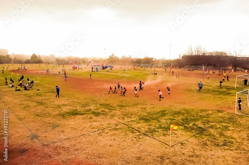 Obraz na plátne JOHANNESBURG, SOUTH AFRICA - Nov 10, 2020: Diverse children playing soccer footb