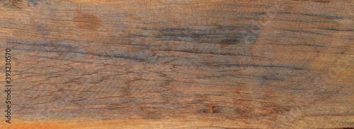 old brown wood texture has a crack.