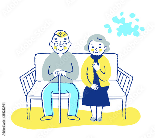ベンチに座る老夫婦