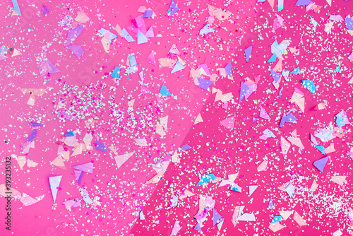 Bright double pink background with  sparkles and glittering confetti of neon colors