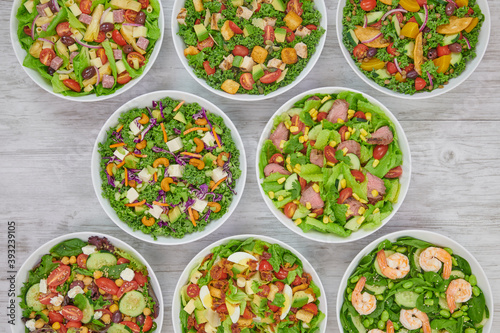 Colorful Fresh Wholesome Salads with Shrimp Edamame, Mediterranean Couscous, Roast Beef, Artichoke Ham, Grilled Chicken & Avocado and Cobb Salads.