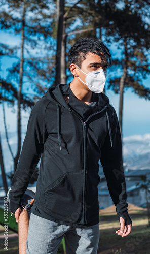 Shot of a sportsman in a protective mask -  new normal photo