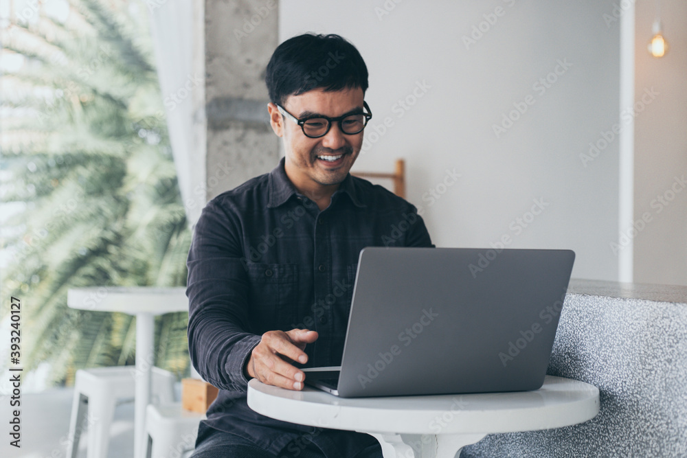 Fototapeta premium using computer.man work hand typing laptop keyboard contact us online chatting search form internet sitting at office.concept for technology device communication business people