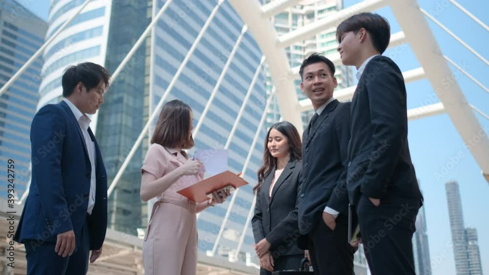 Group of business man and woman meet together in big city and success of dealing project together and they look happy. Concept of successful cooperation business support staff good working. Group of business man and woman meet together in big city and success of dealing project together and they look happy. Concept of successful cooperation business support staff good working.
