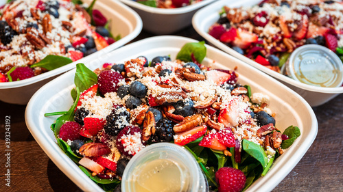 Spinach salad with berries, feta and candied pecan