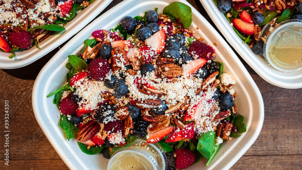 Spinach salad with berries, feta and candied pecan