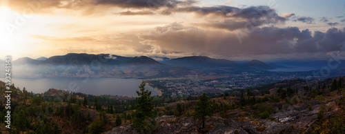 Panoramic view of Penticton City. Dramatic Sunset Sky Art Render. Taken in Skaha Bluffs Provincial Park  British Columbia  Canada.