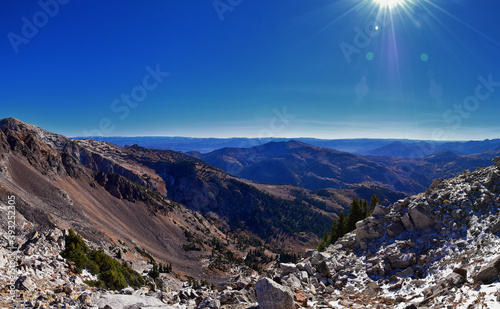 View of mountain landscape from White Baldy and Pfeifferhorn trail, Box Elder and Mill Canyon Peak, American Fork Canyon and Silver Lake in fall, Wasatch Rocky mountain range, Utah, United States.  photo