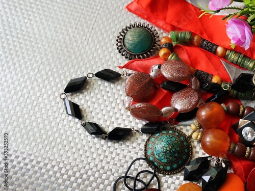 Lots of Indian style jewelry put on the white texture background, for fancy party