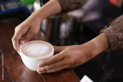 a cup of coffee is ready to be served and drink to customer