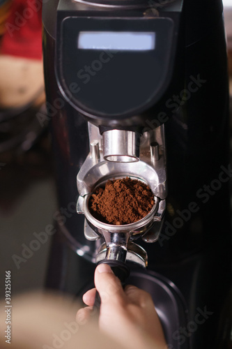 coffee powder from grinder on portafilter
