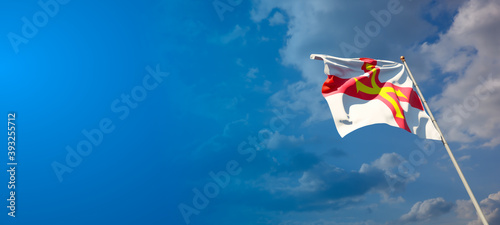 Guernsey national flag with blank text space on wide background.