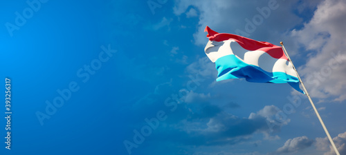 Luxembourg national flag with blank text space on wide background.