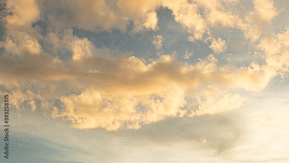 Fototapeta premium Stratocumulus cold in golden hours orange sky. sunlight through clouds.
