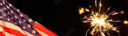 American Celebration - United States, Usa flag and burning sparkler firework on black banner background. American flag for Memorial Day, July 4th, Labor Day concept